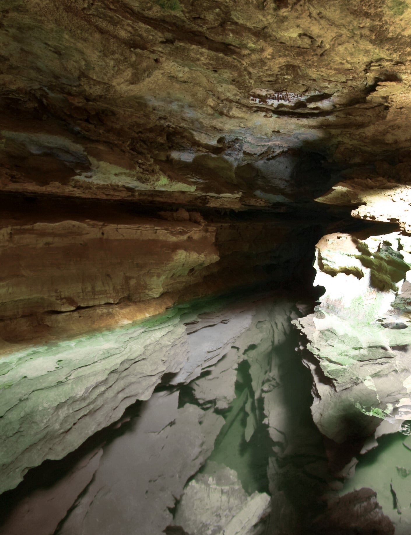 the inside of a cave with water flowing through it