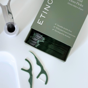 Floss picks paper packaging sliding box with floss picks neatly packaged on white bathroom countertop