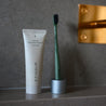 Etinour Essential Whitening Toothpaste tube and Etinour Essential Toothbrush in luxurious Swedish bathroom